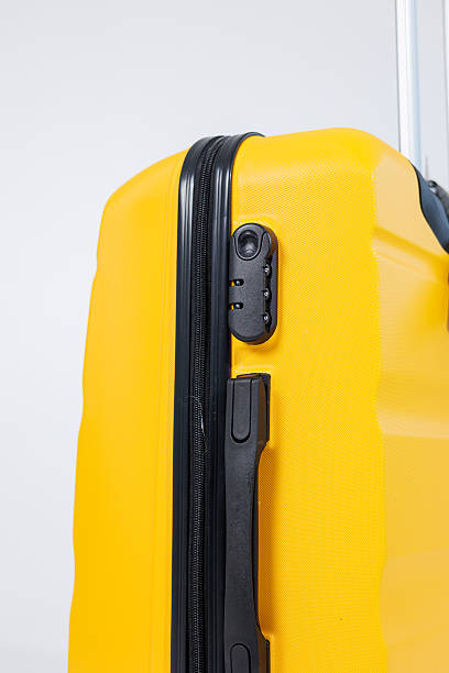istock Yellow bright suitcase for tourist trips. High-quality yellow suitcase 2250613906