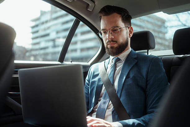 istock Businessman Working on Laptop in Car 2250614557
