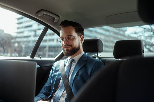 istock Businessman Working on Laptop in Car 2250614560