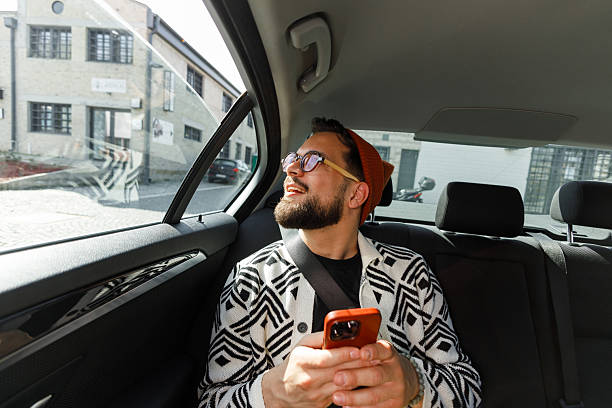 istock Man Having Video Call in Car Backseat 2250614596