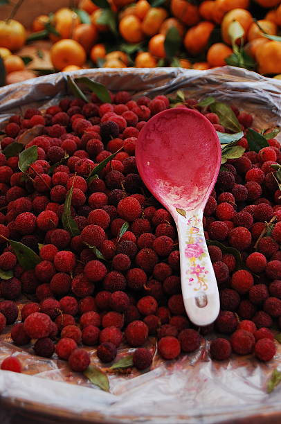 istock Red raspberries with a pink spoon in a basket 2250615048