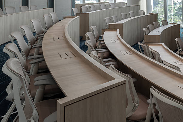 istock Characterized by its distinctly modern, minimalist design and semi-circular, tiered seating, this auditorium provides an ideal setting for focused presentations. 2250615248