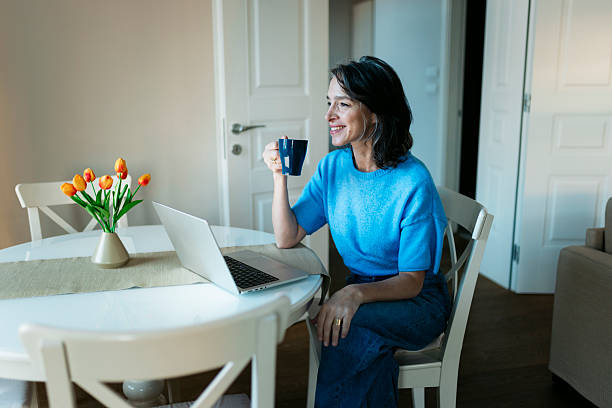 Woman working from home enjoying morning coffee