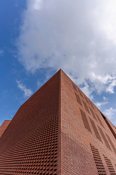 Partial view of a red brick house on a sunny day