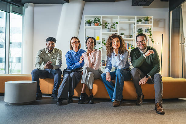 istock Diverse business team smiling posing together in modern office 2250616041