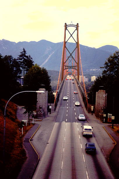 Scenic views of the Lion's Gate Bridge in Vancouver, British Columbia, showcasing coastal landscapes, urban skylines, maritime activity, and natural surroundings.
