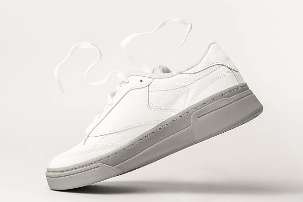 istock Levitation of white sneaker close-up, c 2250616326
