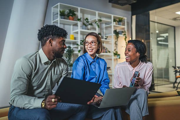 istock Diverse business colleagues collaborating with technology in modern office 2250616412