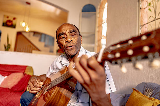 An individual enjoys playing a classic guitar while standing on a sunny balcony. The vibrant colors and shading create a dynamic scene, invoking feelings of creativity and relaxation in this inspiring atmosphere.