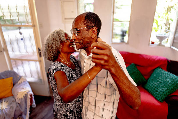 istock Senior couple dancing at home 2250617219