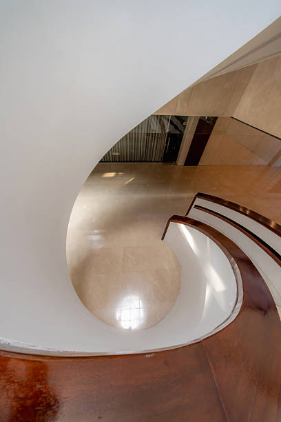 istock Overlooking the bright indoor spiral staircase 2250617270