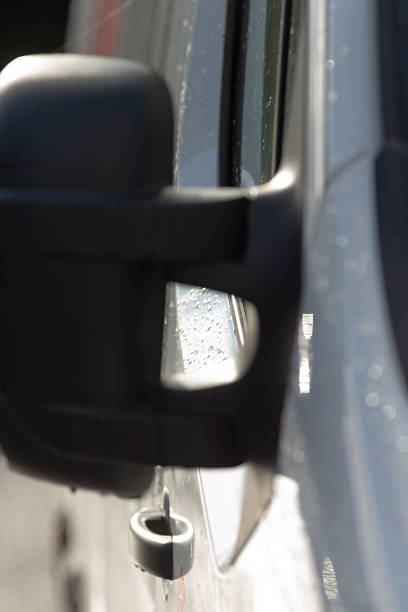 istock Inspect mirror hinge, Fleet supervisor checks roadside mirror hinge state 2250617395