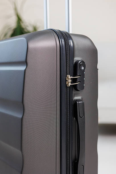 istock Gray beautiful suitcase for tourist trips. High-quality gray suitcase for things. 2250617723