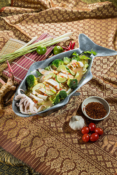 istock thai spicy squid platter with lime and chili garnish 2250618887
