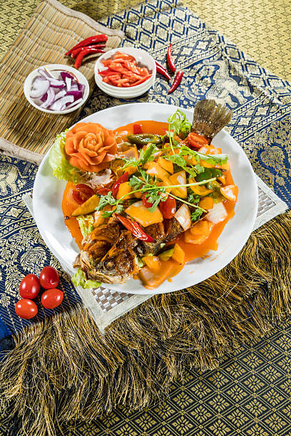 istock thai fried fish with sweet and sour vegetable garnish 2250618930