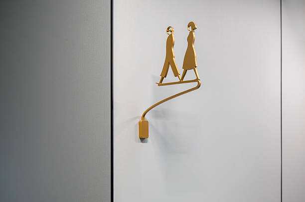 istock Toilet signs on a white wall 2250619322
