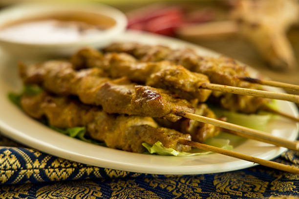 istock satay grilled meat peanut sauce lettuce chili garnish plate 2250620482