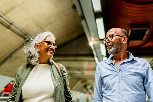 istock Senior couple walking and talking on a subway 2250620968