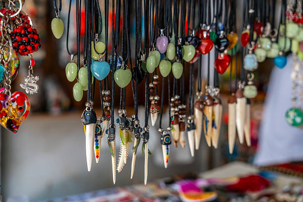 istock Handmade Peruvian Amazon necklaces crafted with seeds, beads and natural materials hanging in a jungle market showcasing artisan craftsmanship. 2250622011