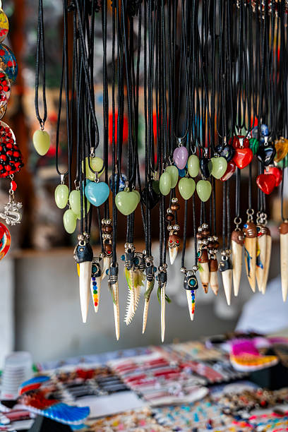 istock Handmade Peruvian Amazon necklaces crafted with seeds, beads and natural materials hanging in a jungle market showcasing artisan craftsmanship. 2250622012