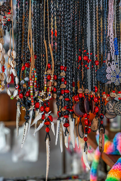 istock Handmade Peruvian Amazon necklaces crafted with seeds, beads and natural materials hanging in a jungle market showcasing artisan craftsmanship. 2250622013