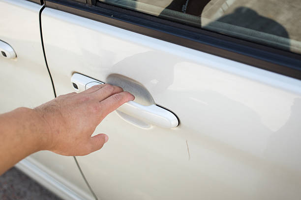 istock hand reaching car door handle white vehicle interaction 2250622655