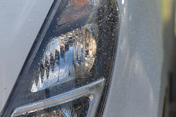 istock Damp vehicle light showcasing water beads and soft illumination effects 2250624466