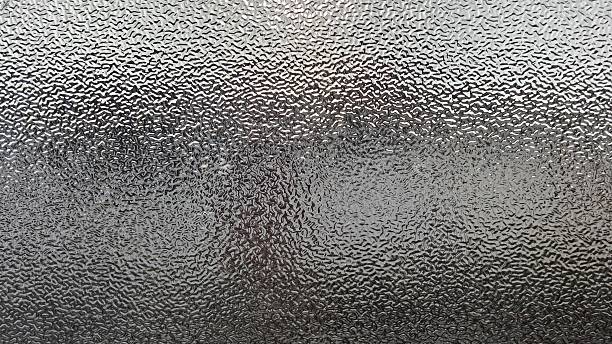 istock Blurred frosted glass texture. Window backdrop with shadows and reflections. Glass effect background. Abstract gradient bright light reflection and shiny rough texture surface 2250624788