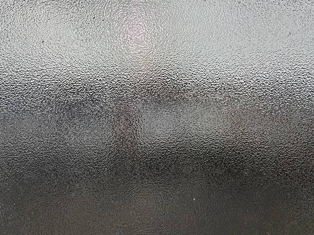 istock Blurred frosted glass texture. Window backdrop with shadows and reflections. Glass effect background. Abstract gradient bright light reflection and shiny rough texture surface 2250624907
