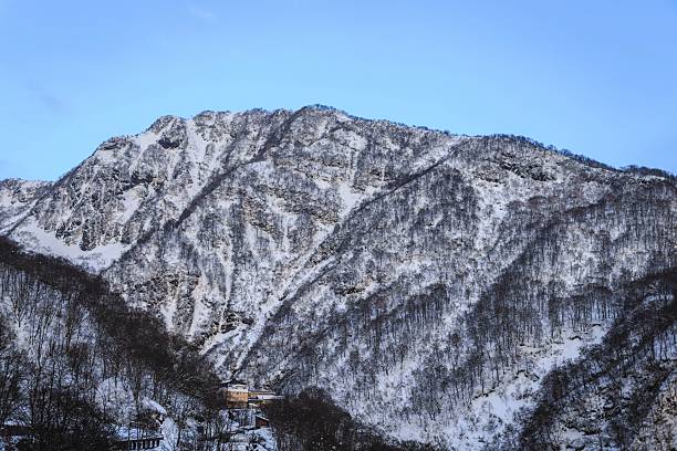 istock Snow-Covered Mountain Range in Winter Twilight, Myoko Kogen, Nagano, Japan 2250625037