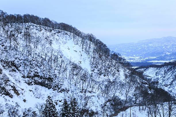 istock Snow-Covered Mountain Range in Winter Twilight, Myoko Kogen, Nagano, Japan 2250625196