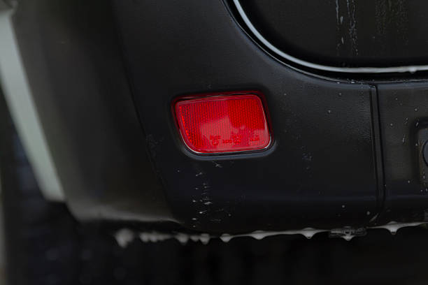 The damaged rear light of a van.