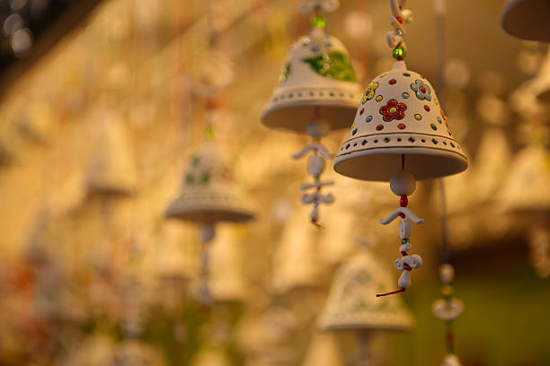 Christmas decoration bell ornaments  in Christmas market during December in Piazza Santa Croce, Florence, Italy