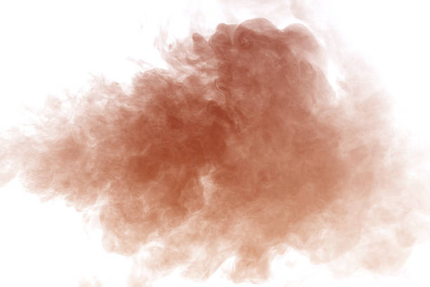 istock Orange dust cloud isolated on white background, realistic powder explosion texture for design overlay, sand or smoke particle effect, abstract motion with warm cinematic atmosphere. 2250630032