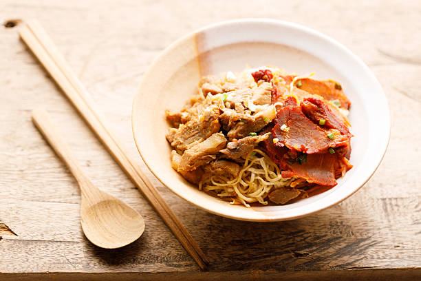 istock Egg Noodles with meat in bowl with chopsticks 2250631761