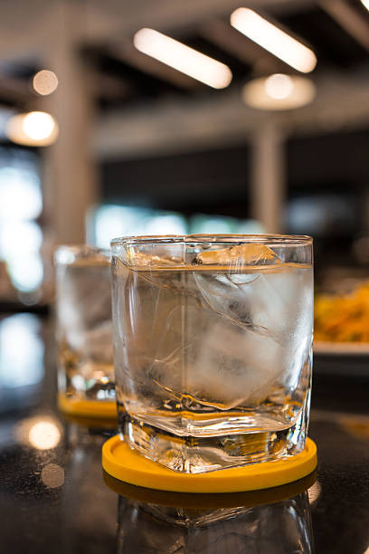 Refreshing glass of water with ice cubes