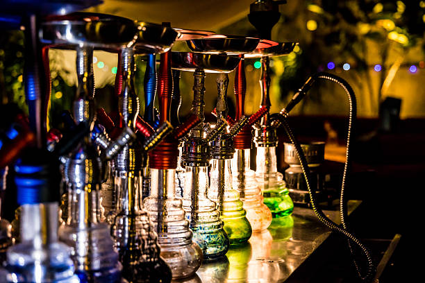 istock hookah row with glass bases and warm lighting 2250636101