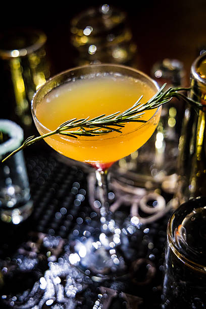 istock orange cocktail rosemary garnish bar scene 2250636181