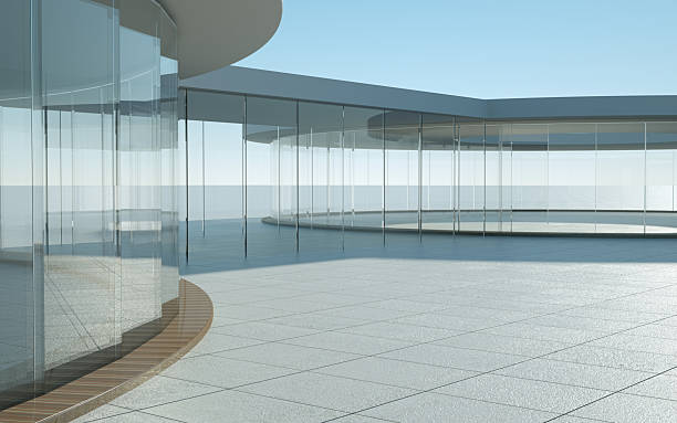 istock Modern glass building with spacious outdoor area under clear sky 2250640281