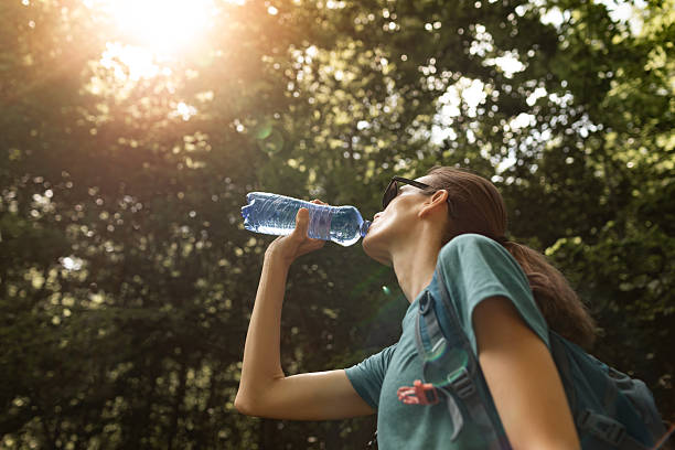 istock Active Woman drinking water outdoors 2250641533