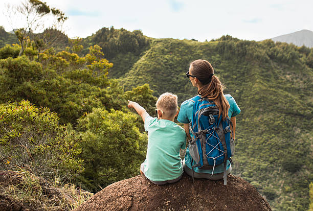 istock Mother and son enjoying beautiful view during their hike. 2250641618