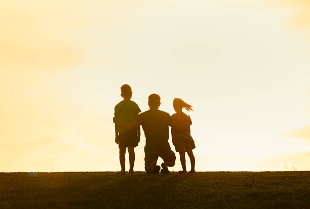 istock Dad Sharing a Quiet Moment In Nature With His Children 2250641673