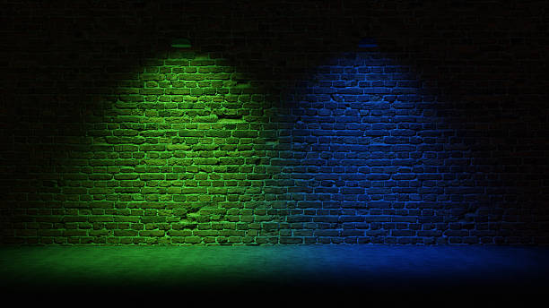 istock Brick Wall Background, Rough Concrete With Glowing Green and Blue Lights 2250643270