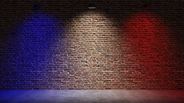 istock Brown brick wall background with spot lighting effect. Blue, red 2250643370