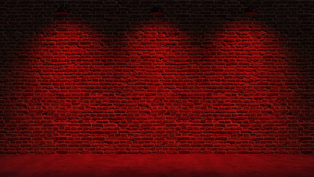 istock Brown brick wall background with spot lighting effect. Blue, red 2250643431