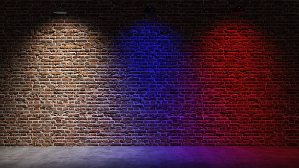istock Brown brick wall background with spot lighting effect. Blue, red 2250643478