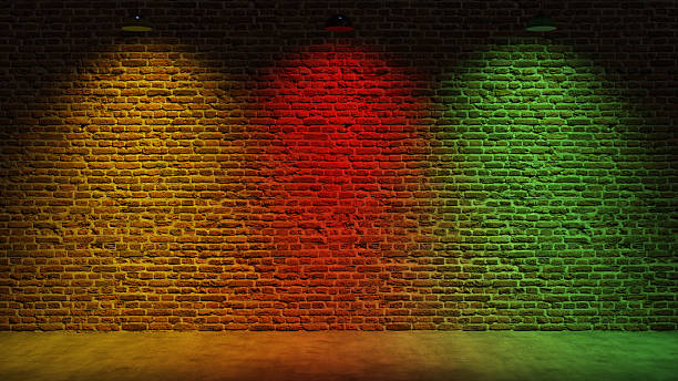 istock Brown brick wall background with spot lighting effect. Blue, red 2250644063