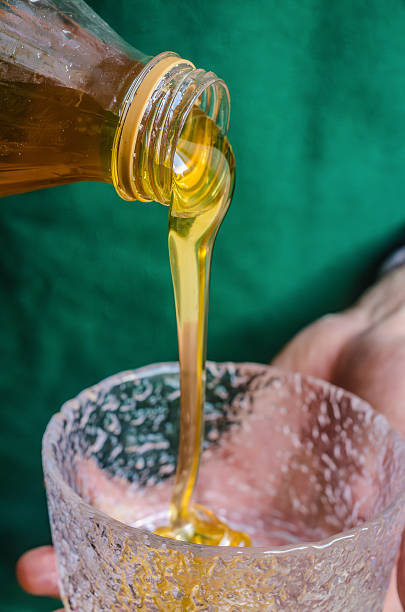 istock Pouring Golden Honey Into a Glass Bowl 2250647367