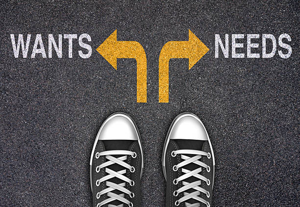 istock Decision at a Crossroad - Wants or Needs 2250648066