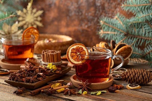 istock Christmas herbal tea with ingredients on a old wooden table. 2250650525